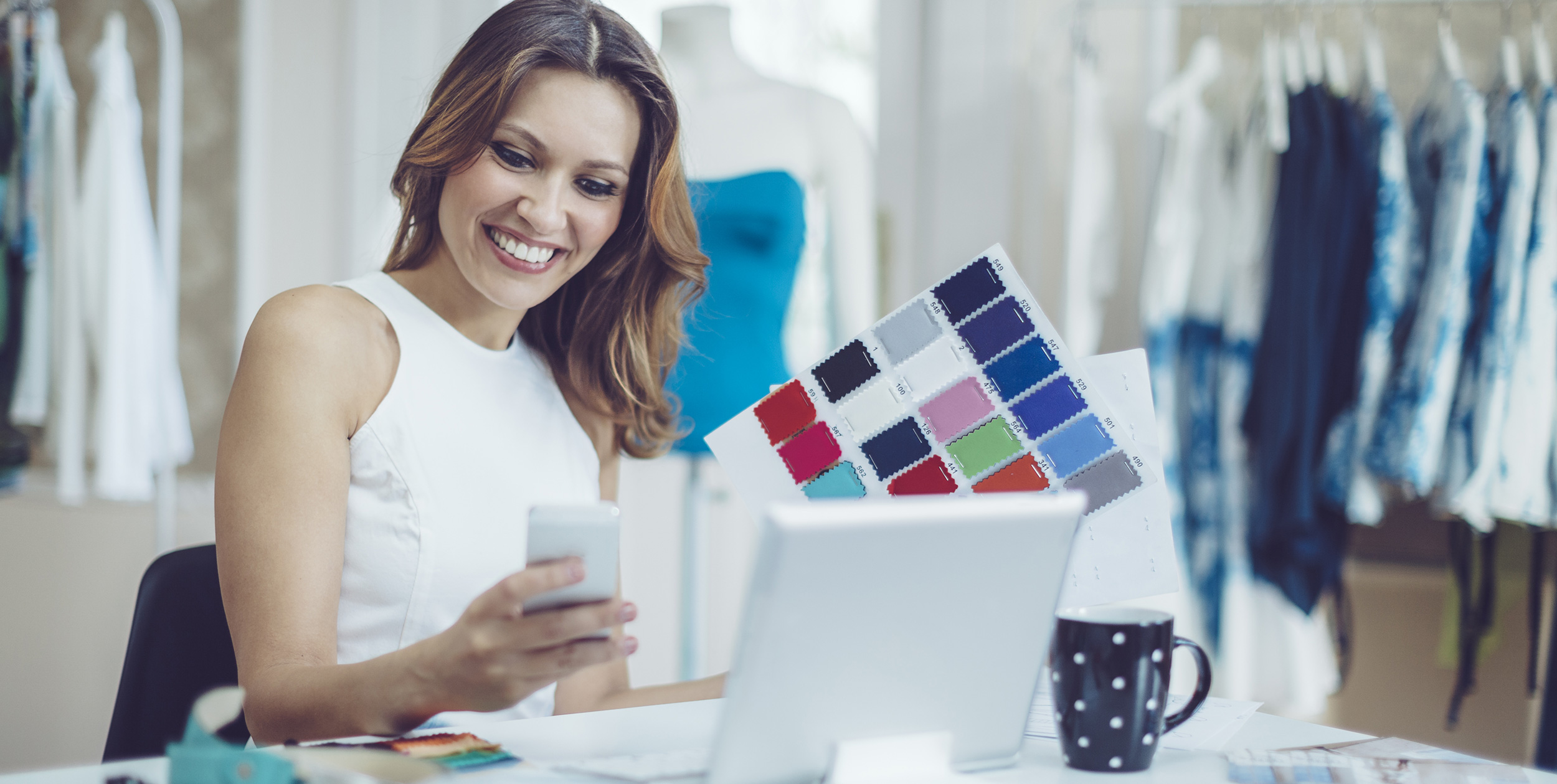 Woman smiling and looking at a debit card